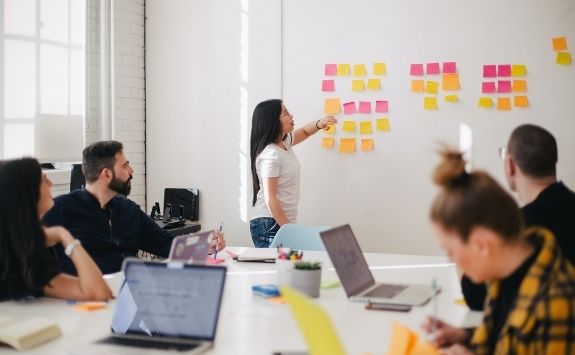 Woman at white board